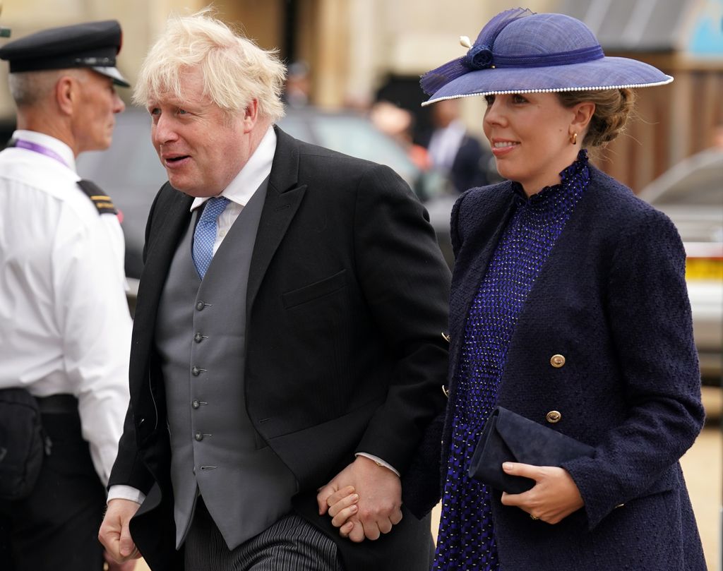 Boris and Carrie Johnson walking hand in hand