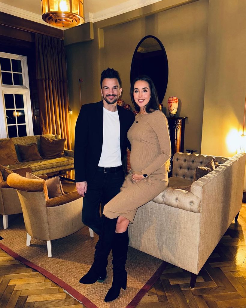 Peter Andre and pregnant wife Emily Andre posing in house 