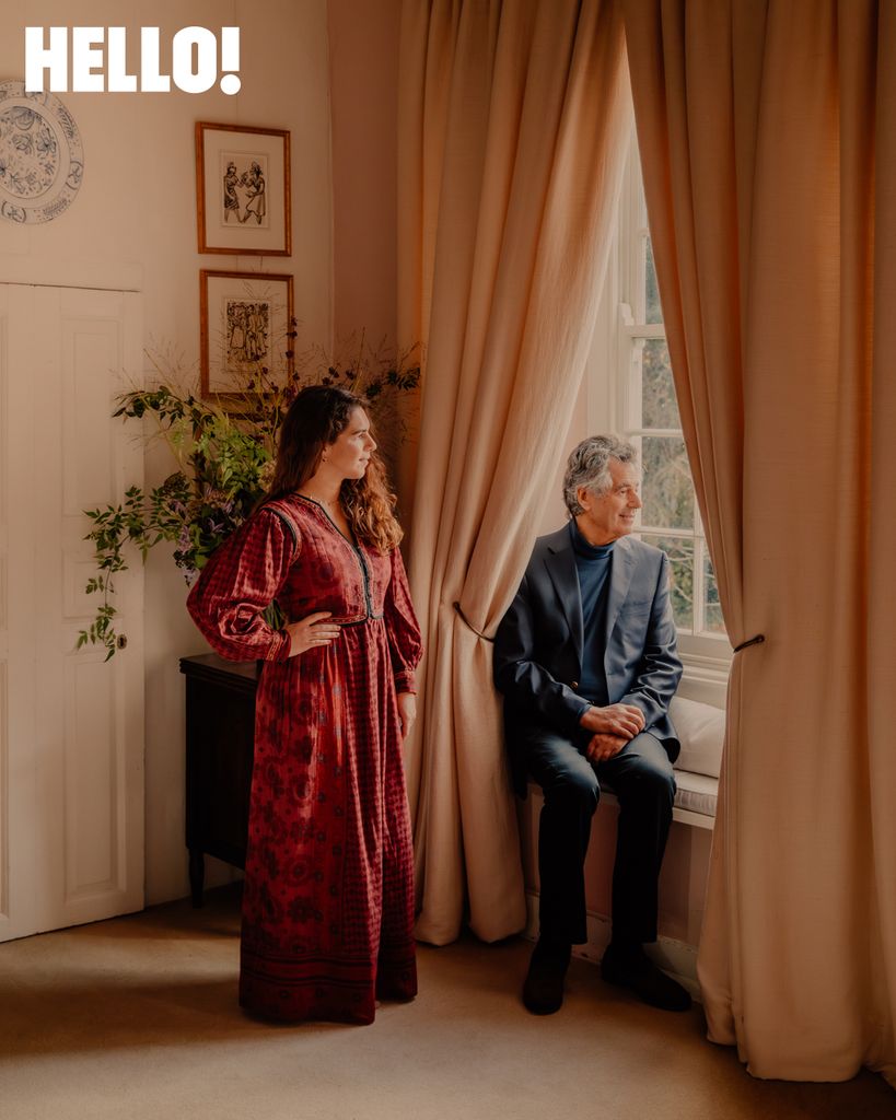 Olympia and Emmanuel Olympitis standing by the window 