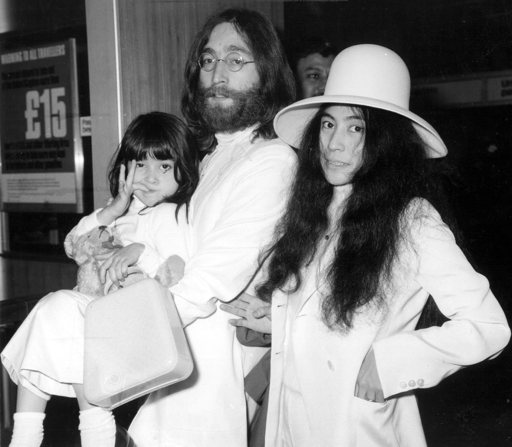 John Lennon with his wife Yoko Ono and her daughter Kyoko at Heathrow airport