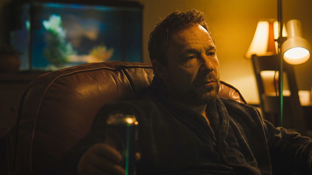 Stephen Graham sits in chair as Andy in still from Boiling Point