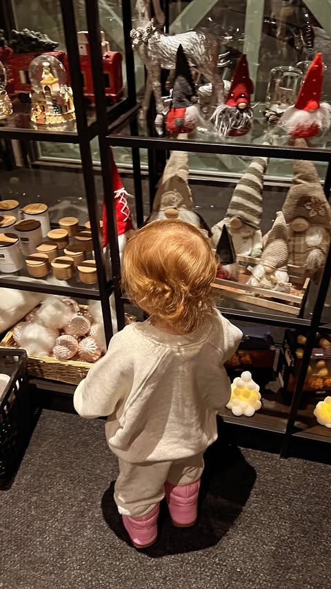 young girl with red hair in gift shop 