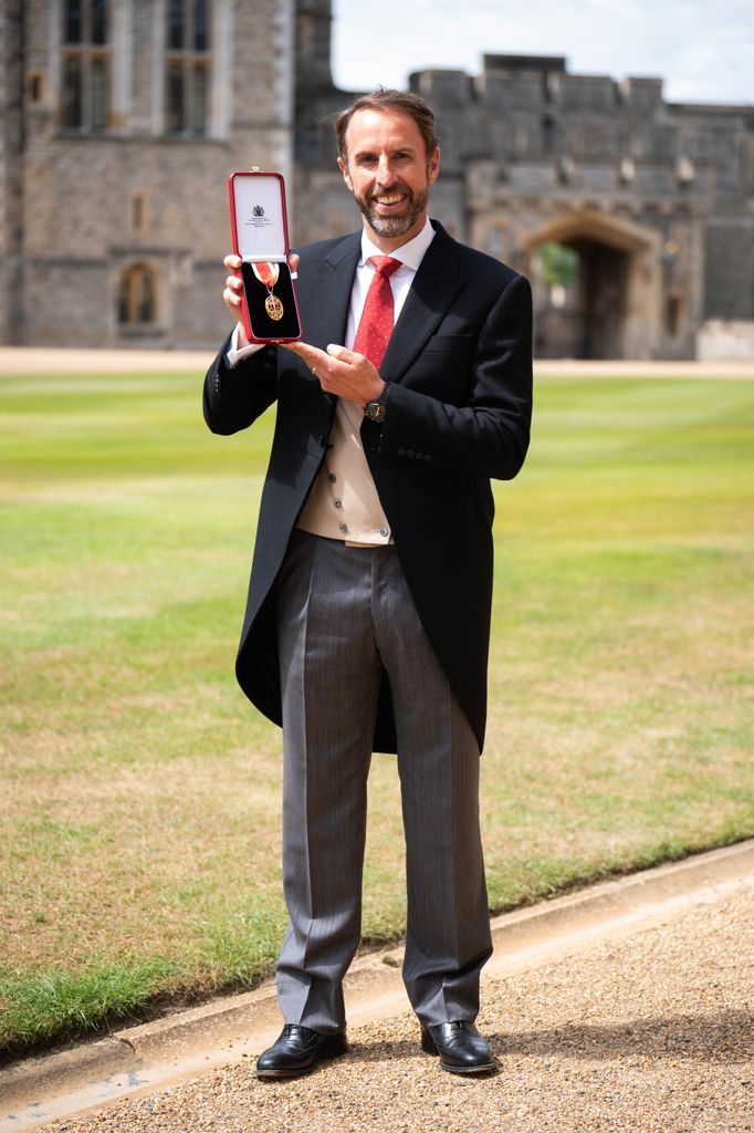 Sir Gareth Southgate poses after being made a Knight Bachelor by the Prince of Wales during an Investiture ceremony at Windsor Castle 