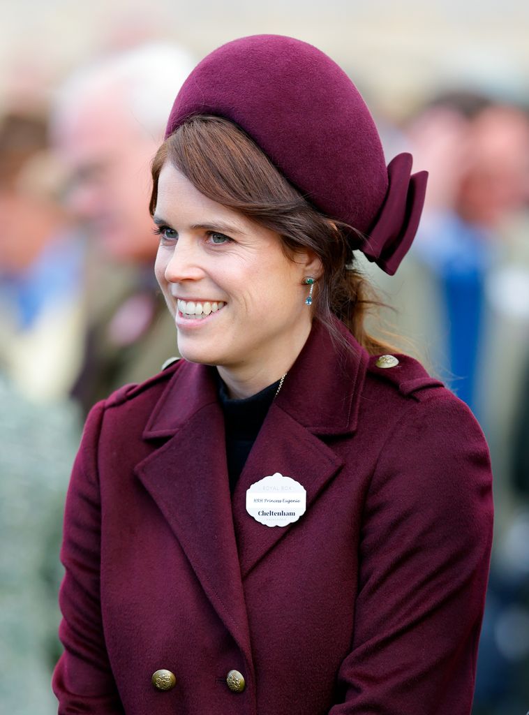 Princess Eugenie wearing burgundy hat and coat