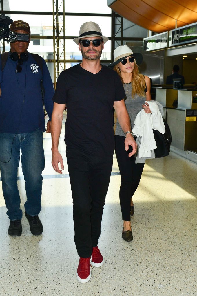 Ryan and Hilary walking through airport 