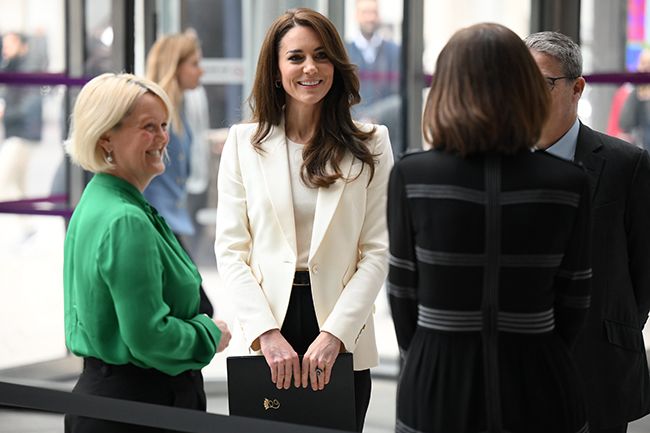 kate middleton smiles as she speaks to guests at her business task force forum