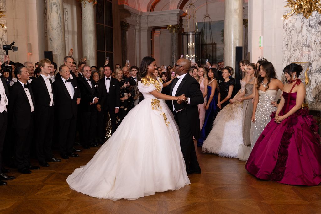 Bronwyn Vance and her father Courtney Vance sharing a dance surrounded by people at ball