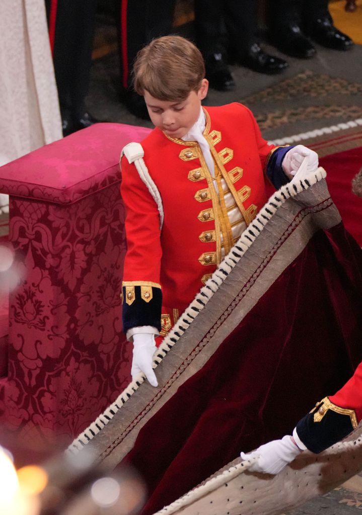 Prince George helping his grandfather the King