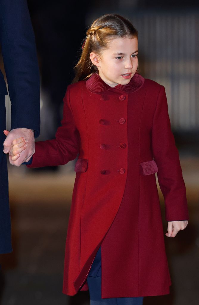 Princess Charlotte wearing one of her go-to hairstyles, with two braids pulled back from the front