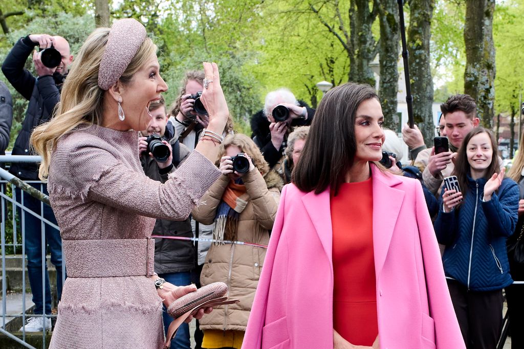 Queen Letizia and Queen Maxima waving