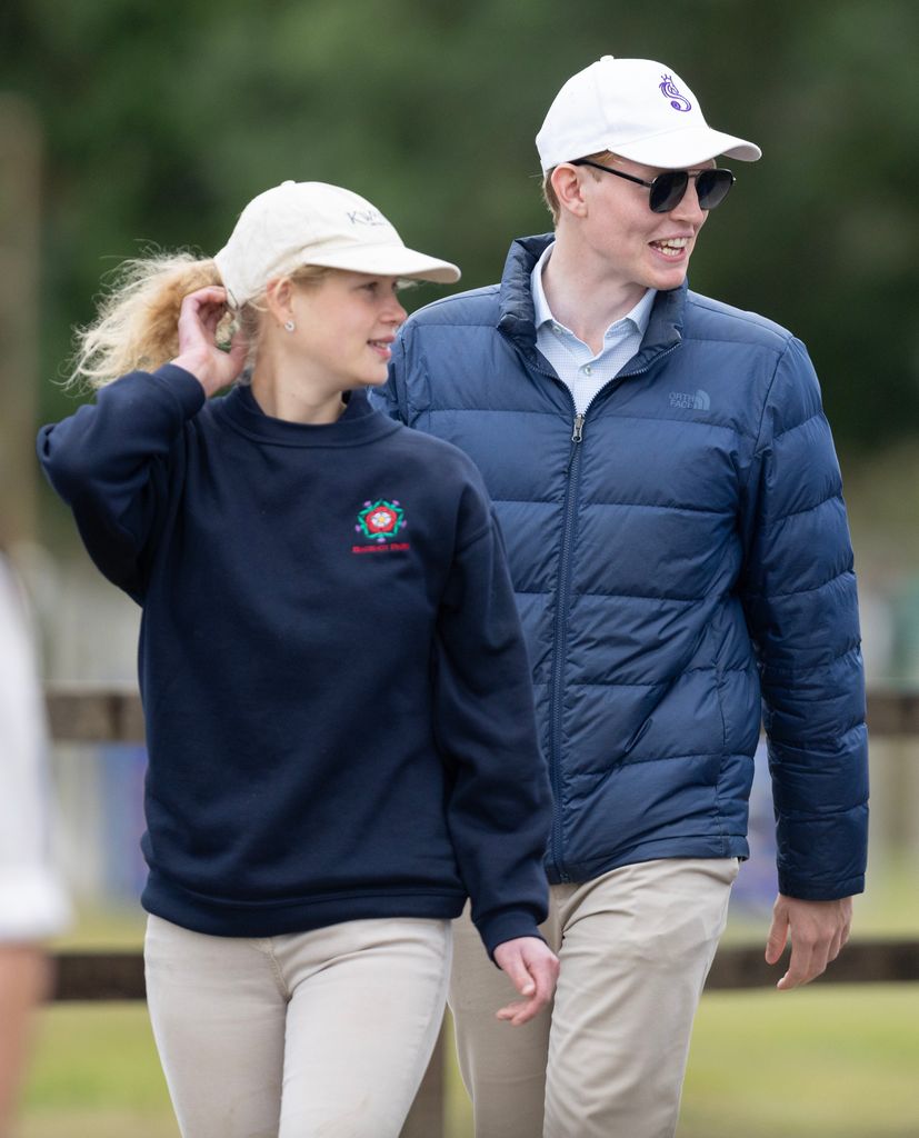 Lady Louise Windsor twirls her hair as she leaves with Felix da Silva-Clamp