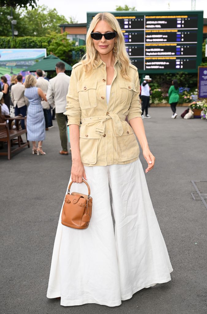 Poppy Delevingne, wearing Ralph Lauren, attends day seven of the Wimbledon Tennis Championships at the All England Tennis and Croquet Club on July 06, 2025 in London, England