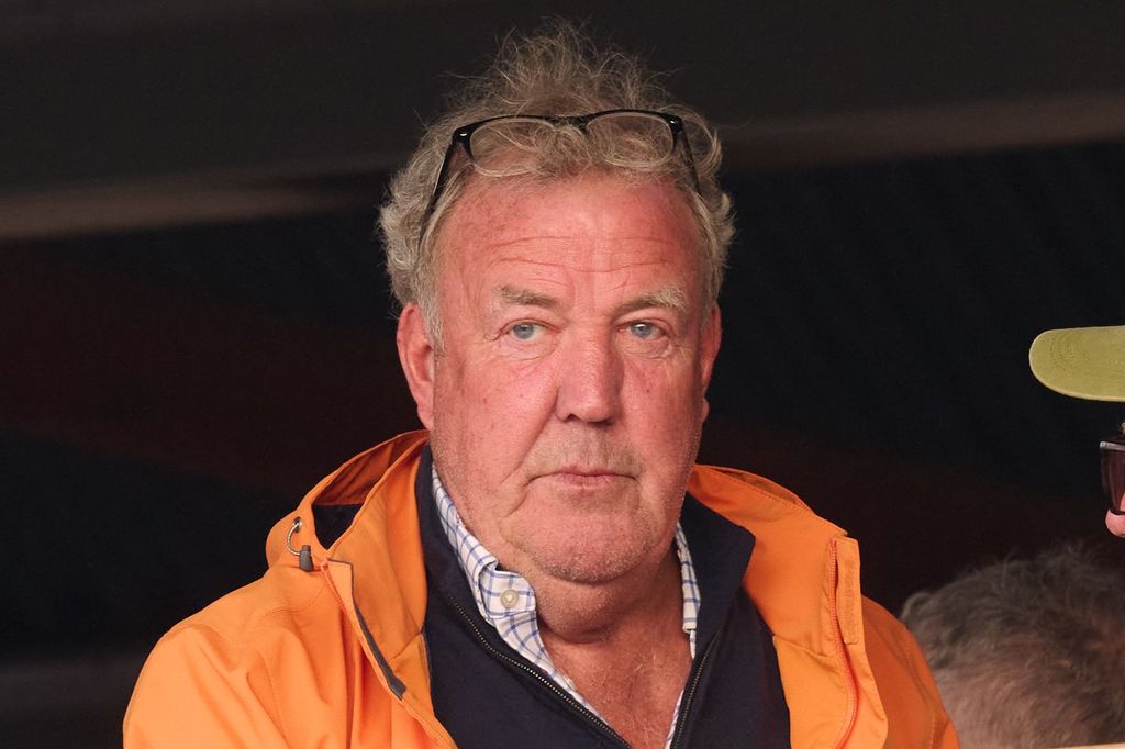 Jeremy Clarkson looking serious in an orange jacket