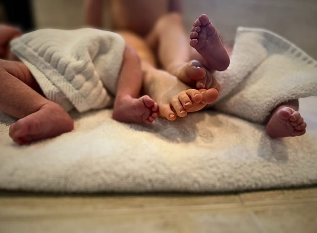 Amber Heard's newborn twins Ocean and Agnes' feet feature in a photo shared on Instagram