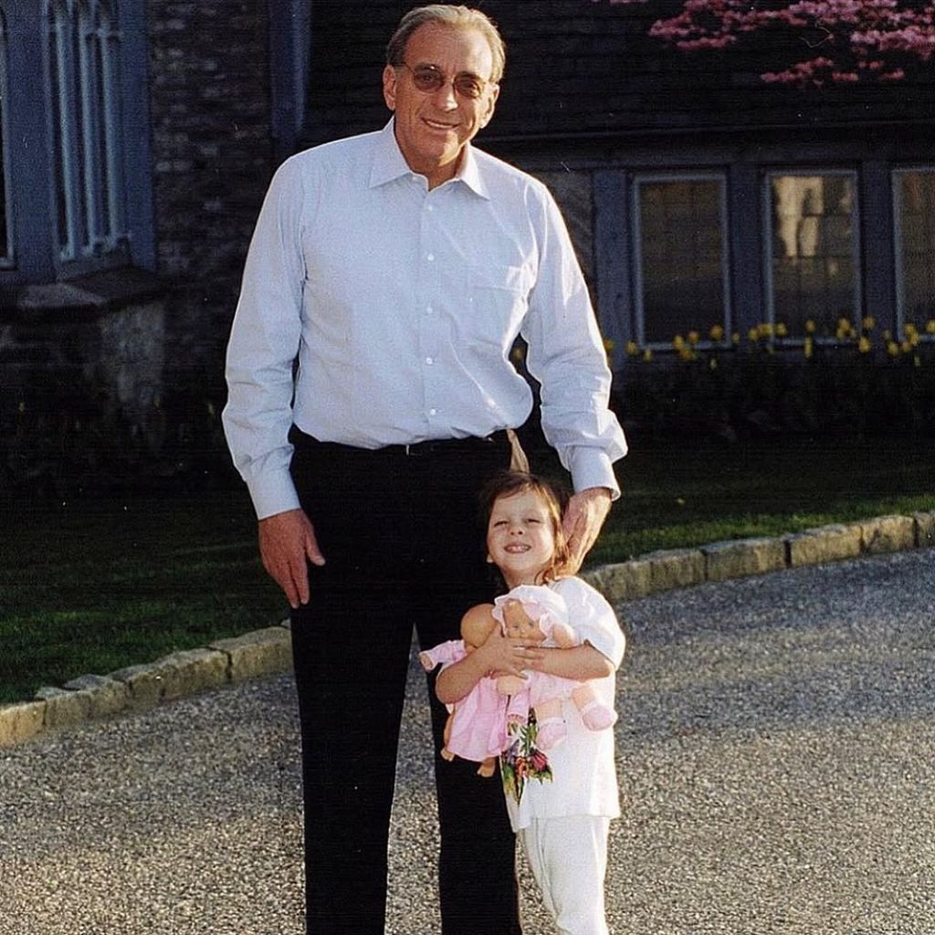 Nicola as a child next to her dad Nelson Peltz