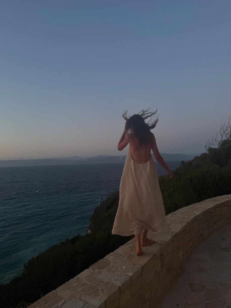 Sunday Rose in a backless dress