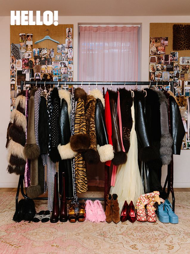 inside a fashion design studio with coats hanging up