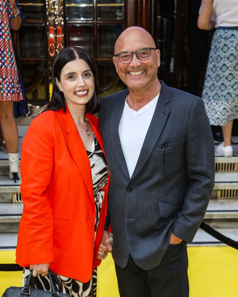 Anne-Marie Sterpini in a red dress and Gregg Wallace in a grey suit