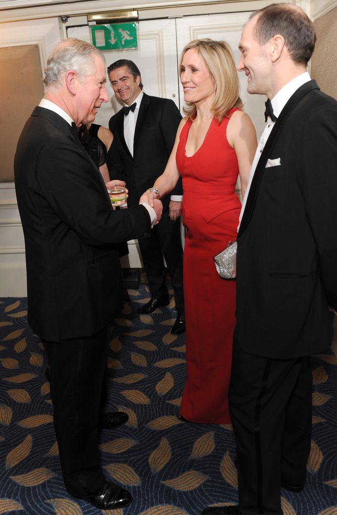 Sophie Raworth and Richard Winter shaking King Charles' hand
