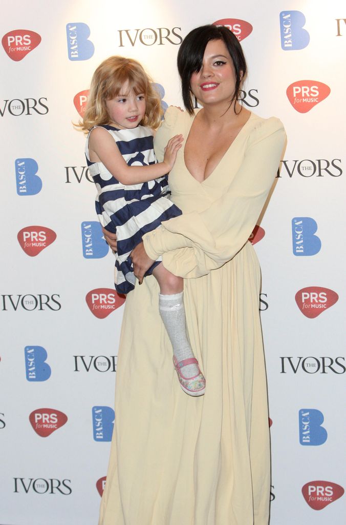 lily allen holding half sister teddie allen as a child