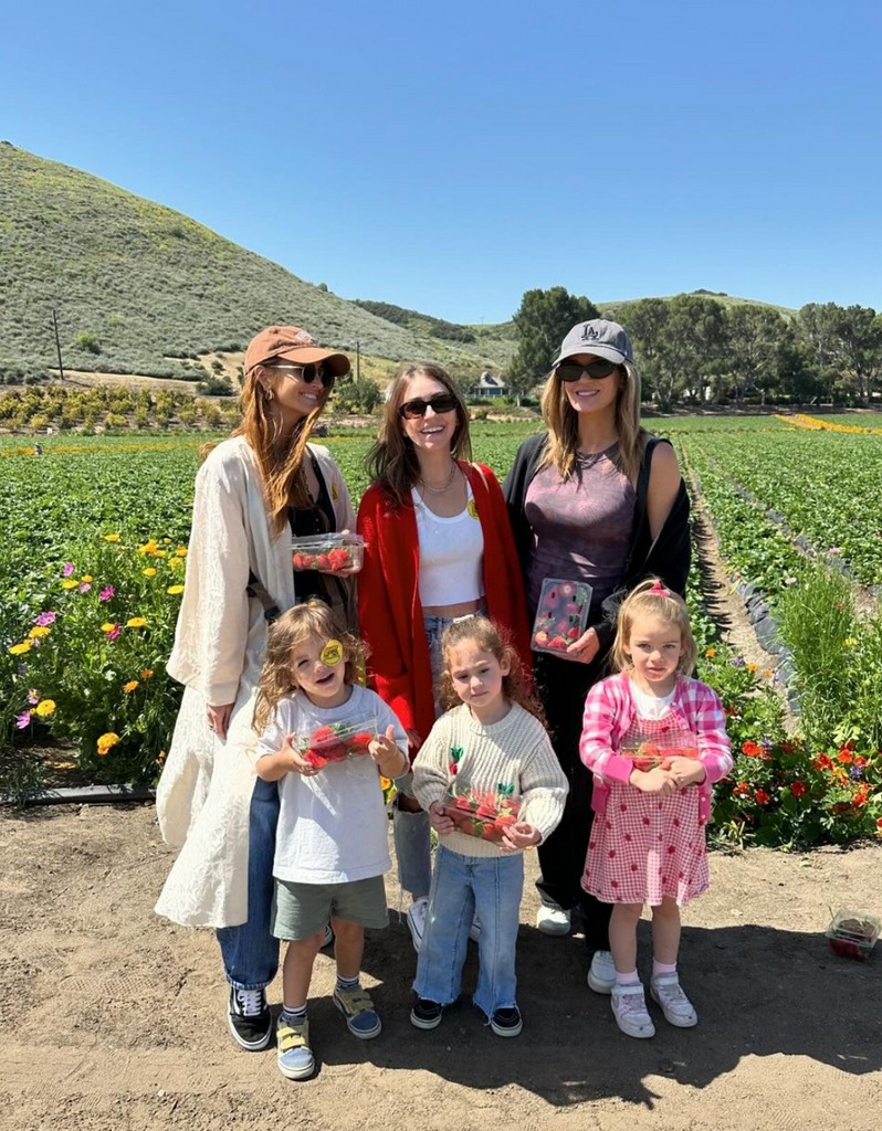 Photo shared by Ashlee Simpson on Instagram May 2024 of her with friends and son Ziggy, who she shares with Evan Ross, standing in a strawberry field