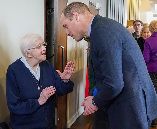 Prince William with an elderly lady