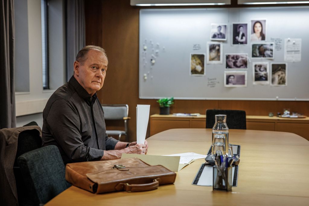 man sitting at desk in office