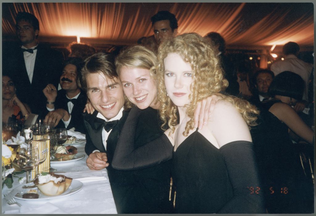 Tom Cruise, Nicole Kidman and Naomi Watts pose close together at a party, circa 1995