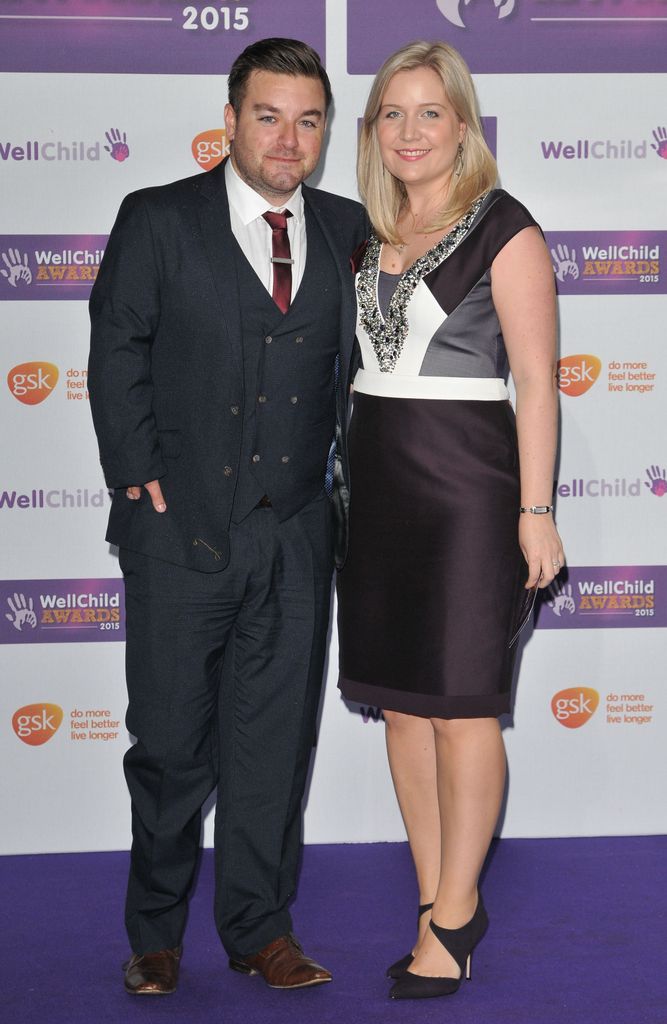 Alex Brooker and Lynsey Brooker dressed formally posing for photos as WellChild Awards
