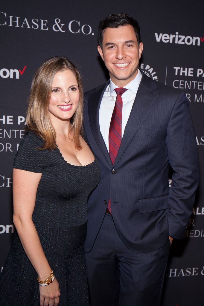 Tom and his wife Jennifer smile for the cameras