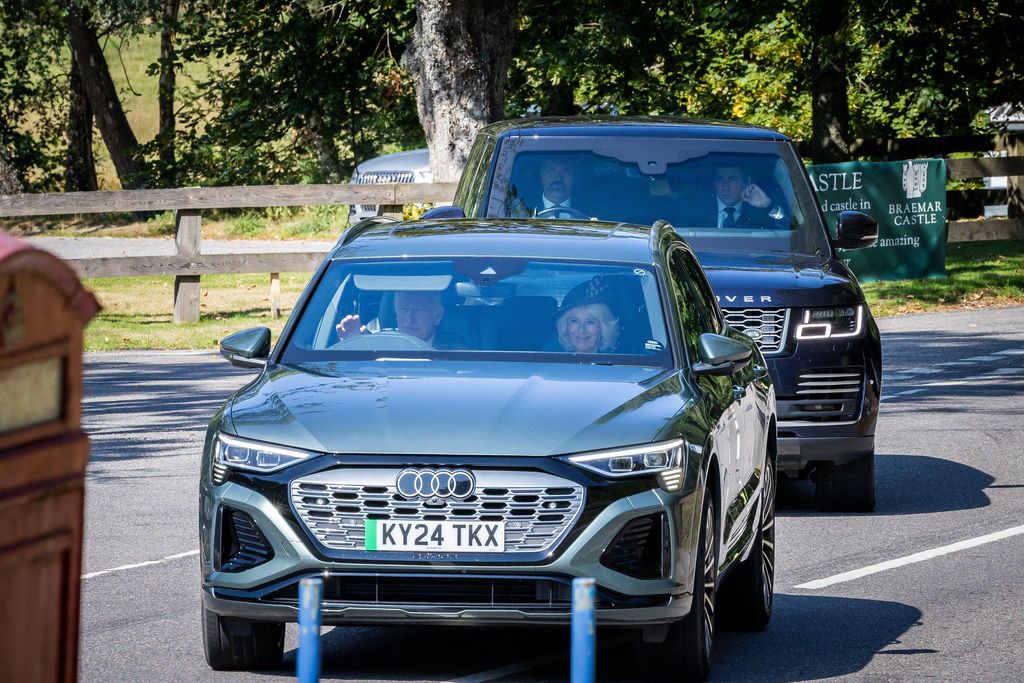 King Charles and Queen Camilla driving in Audi car