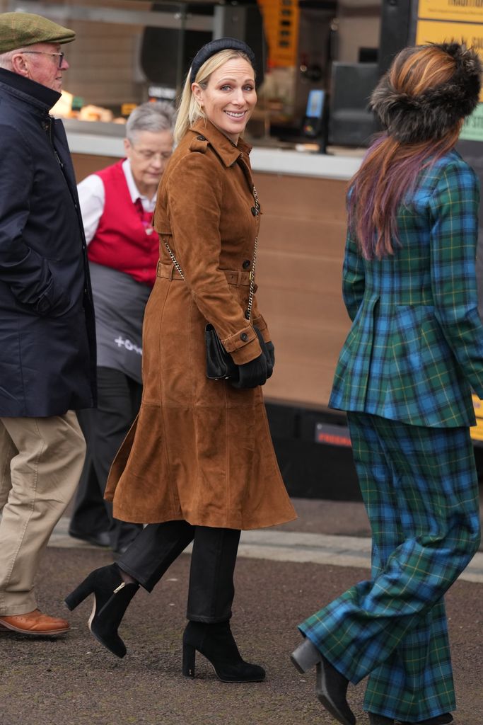 Zara in tan coat and black boots