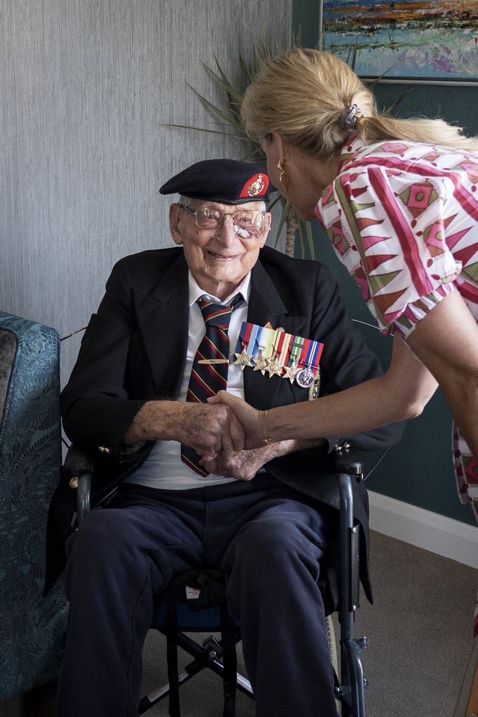 Sophie shaking hands with James 'Jim' Wren