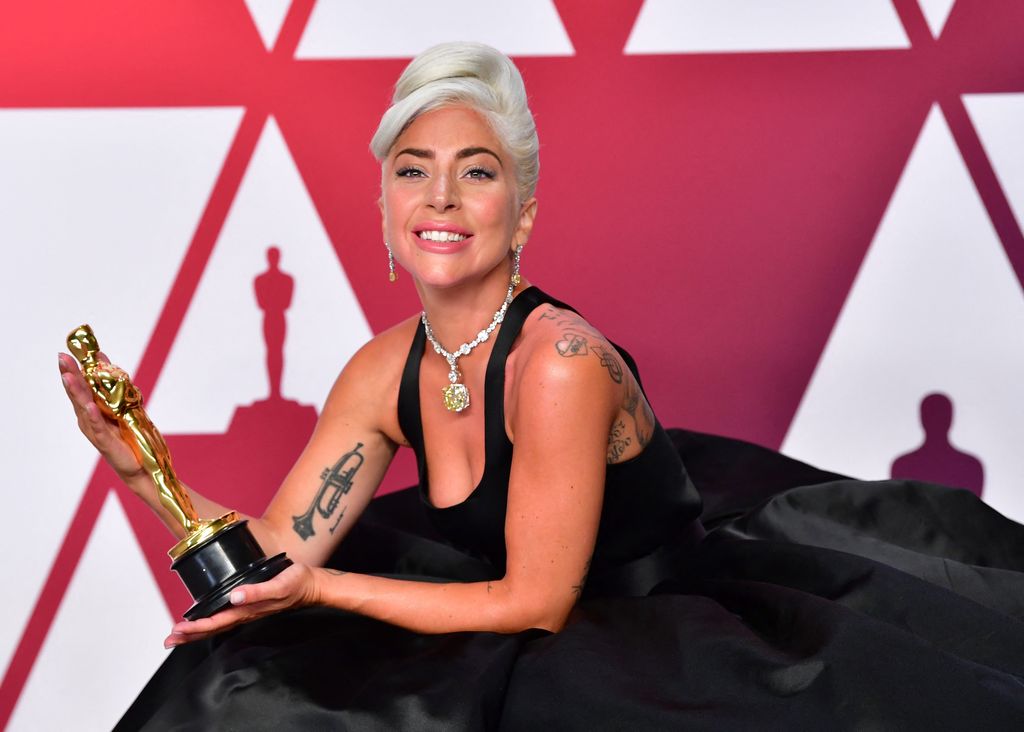 Lady Gaga in black dress poses in the press room with the Oscar during the 91st Annual Academy Awards at the Dolby Theater in Hollywood, California on February 24, 2019.