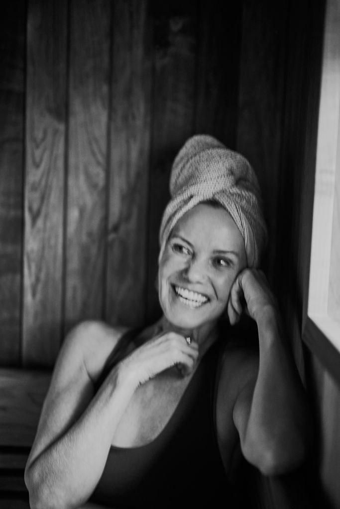Woman smiling with a towel around her head