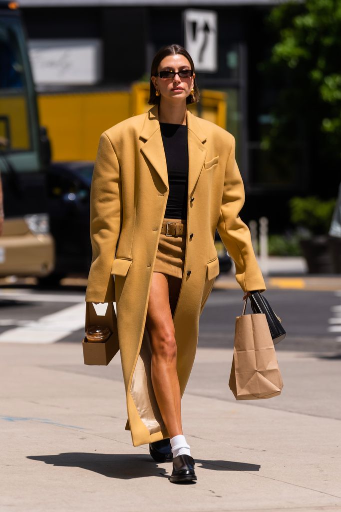 Hailey rocking a black and caramel ensemble in NYC