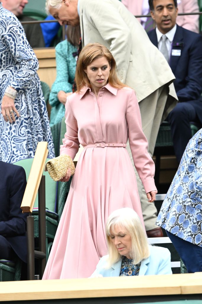 Princess Beatrice in pink belted Emilia Wickstead dress walking down stairs at Wimbledon