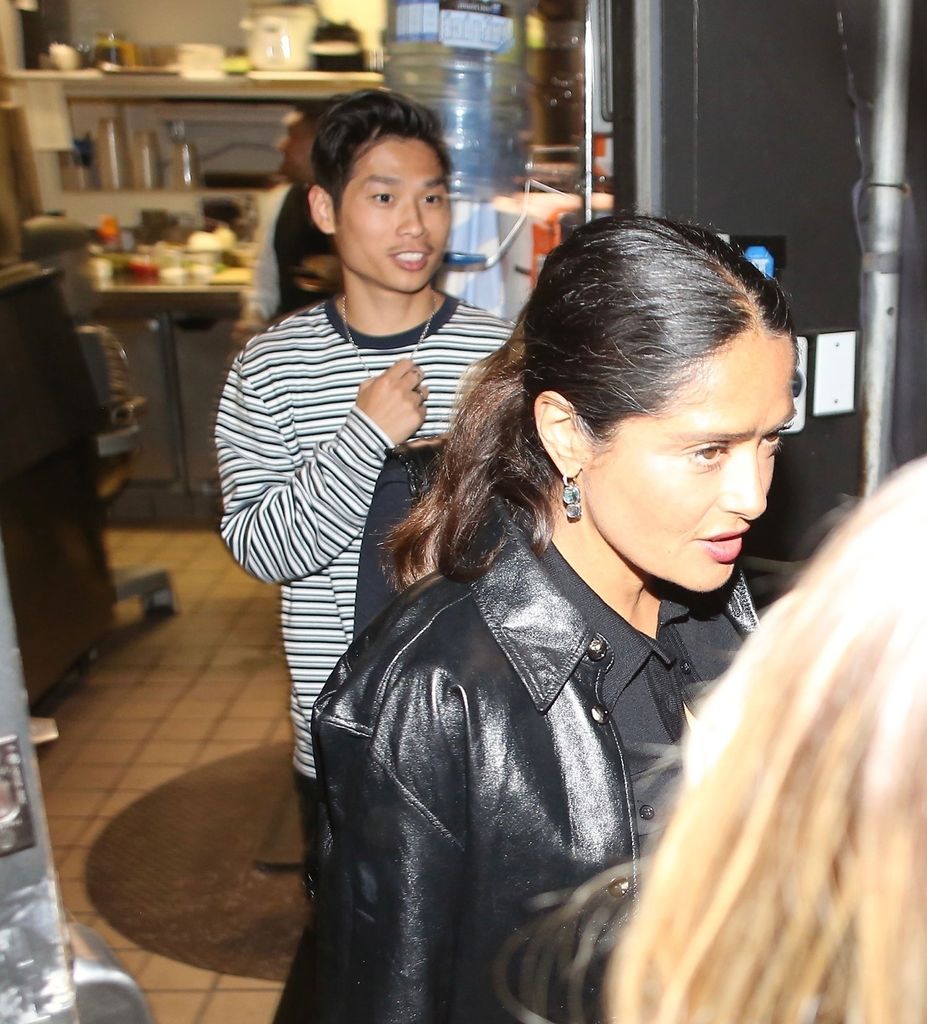 Angelina's son Pax leaves the restaurant with family friend, Salma Hayek