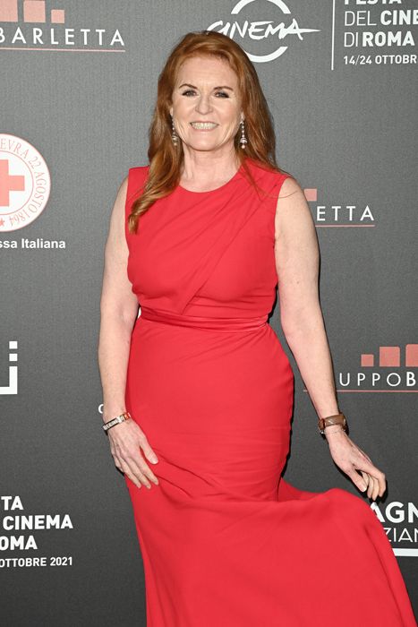 Sarah Ferguson smiling in a red dress