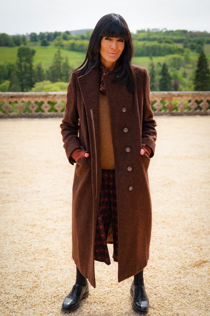 Claudia Winkleman wearing zara outfit and brown coat on the traitors with a pair of black brogues