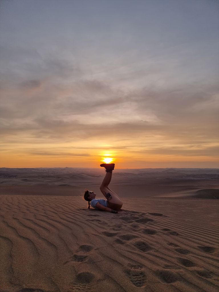 Woman lying on the ground in the desert 
