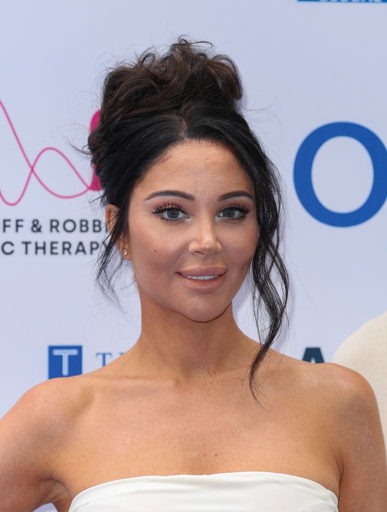 Tulisa Contostavlos on the red carpet in a strapless top