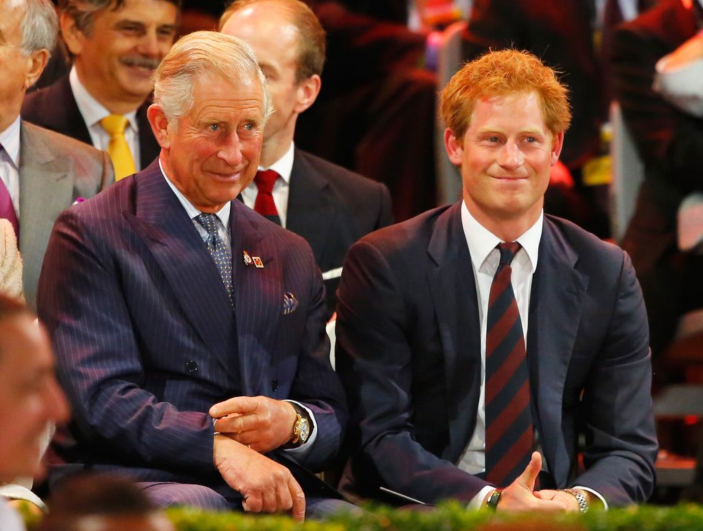 Prince Harry and King Charles in suits smiling