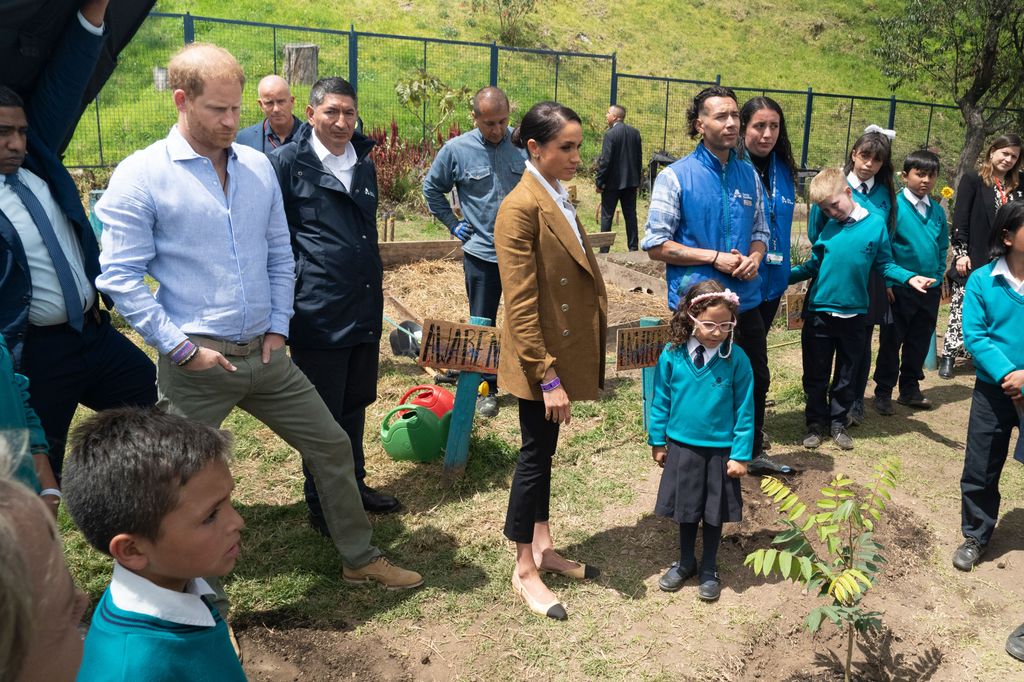 The Sussexes with school children outside