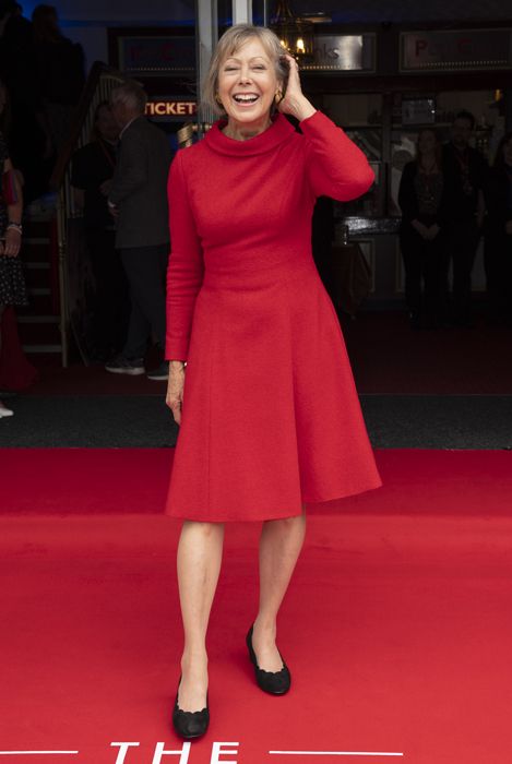Jenny Agutter laughing in a red dress on the red carpet