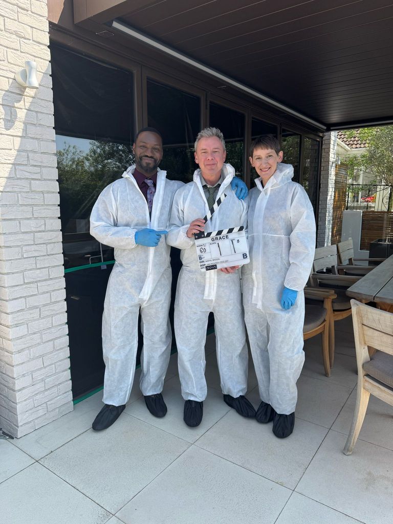 Three actors in forensic suits in the TV show