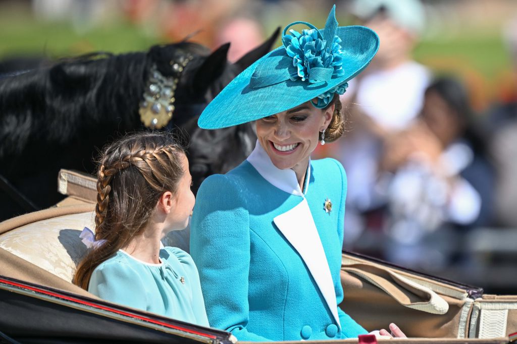 Catherine, Princess of Wales, shares a sweet moment with her daughter, Princess Charlotte, at the Trooping the Colour 2025 parade