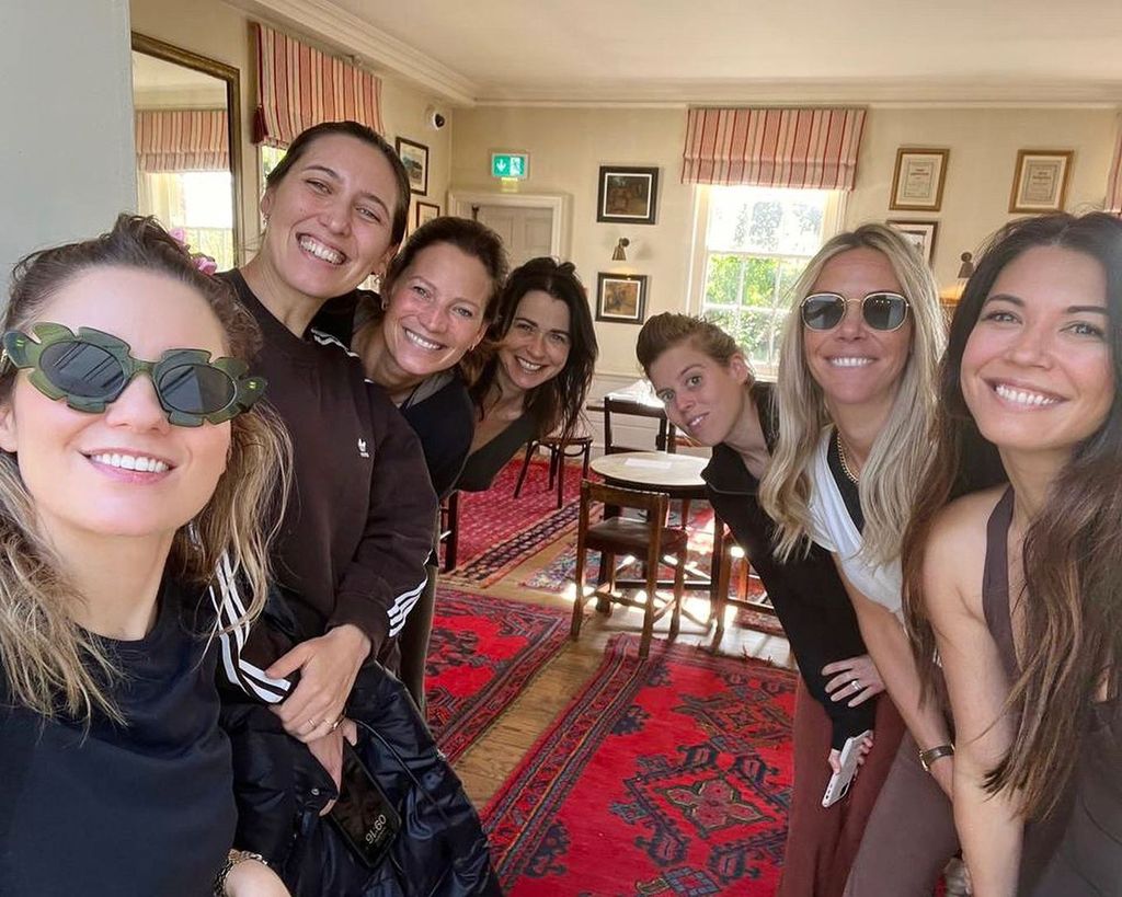 Princess Beatrice appeared in the background of a group selfie taken on the retreat