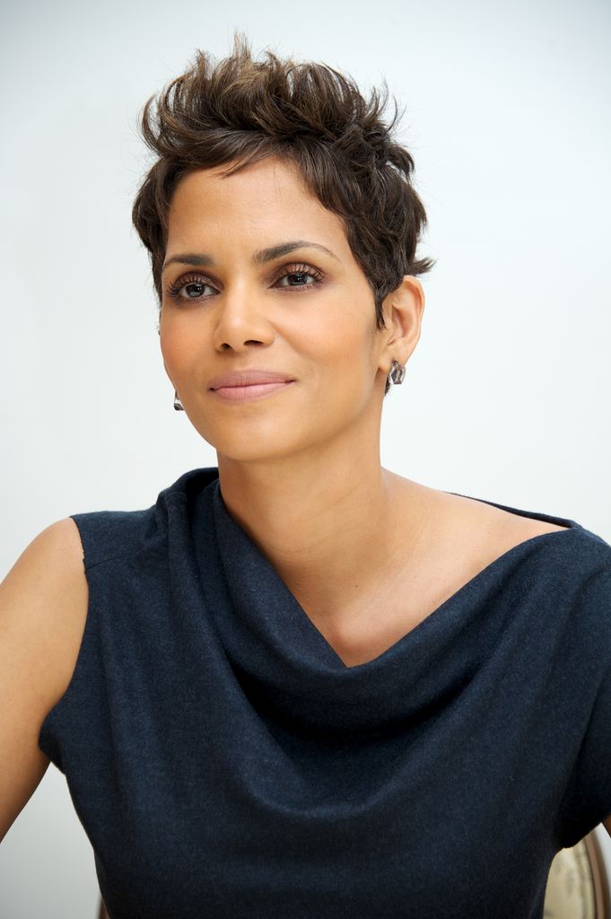 Halle Berry in navy cowl dress with pixie hair