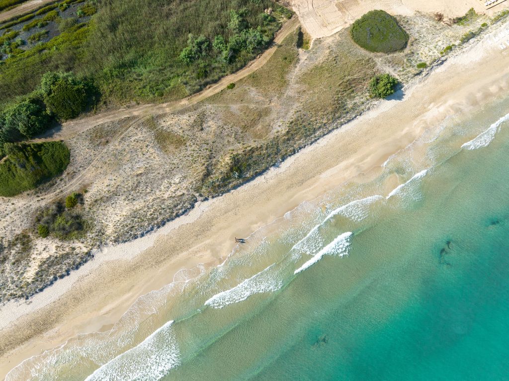 natural sand dunes and blue sea 